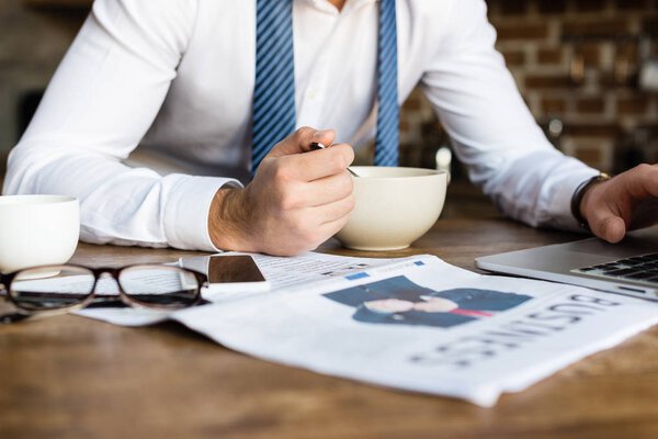 businessman eating breakfast