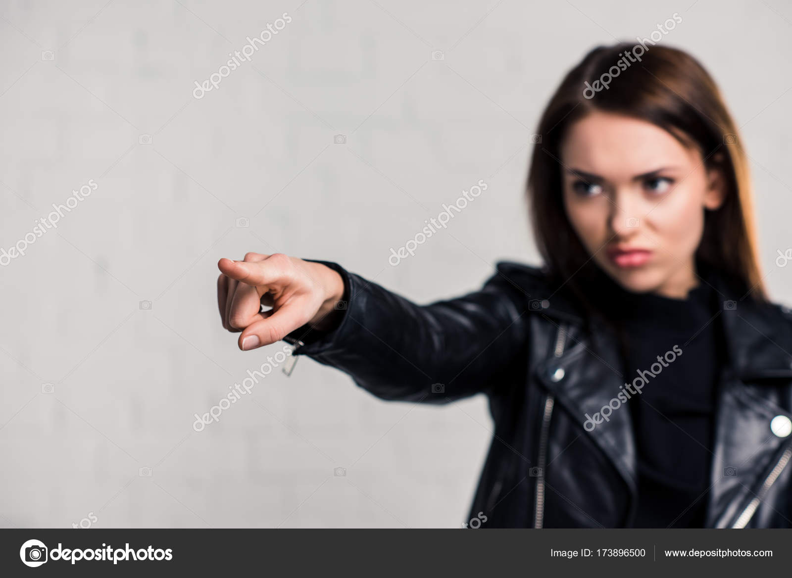 Angry woman pointing on something Stock Photo by ©AlexLipa 173896500