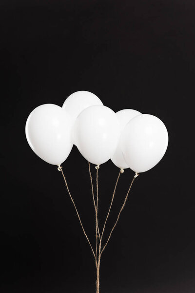 Bundle of white balloons