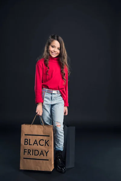 Child holding shopping bags — Stock Photo, Image