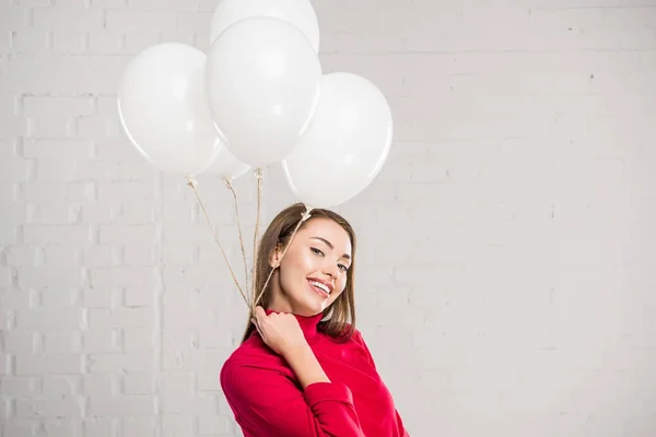 Woman with helium balloons — Stock Photo, Image