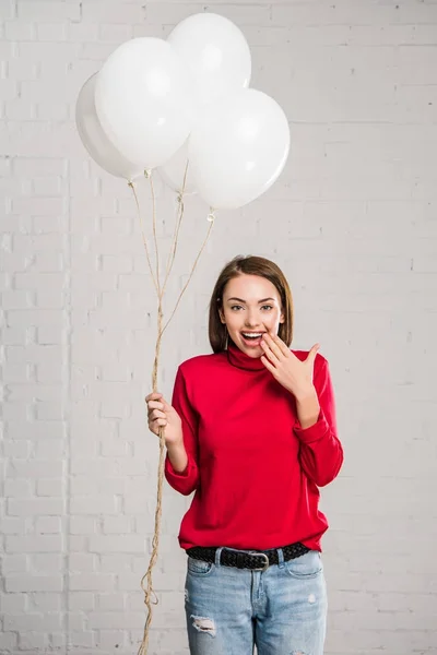 Woman with helium balloons — Stock Photo, Image