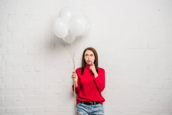 Woman with helium balloons — Stock Photo, Image