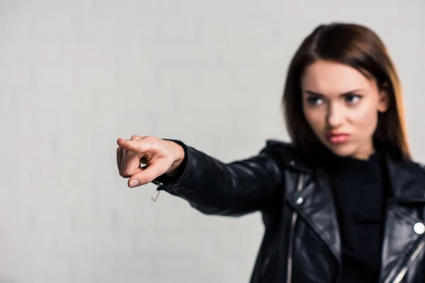 Angry woman pointing on something — Stock Photo, Image