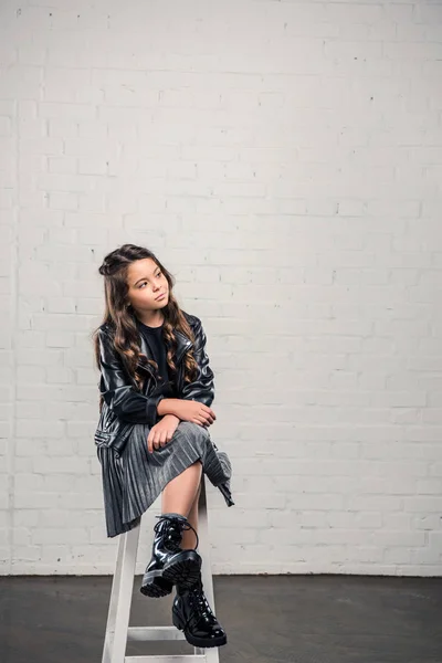 Skeptical stylish kid — Free Stock Photo