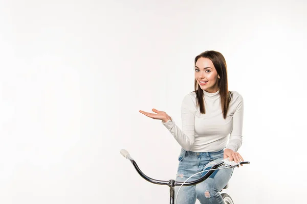 Woman sitting on bicycle — Free Stock Photo