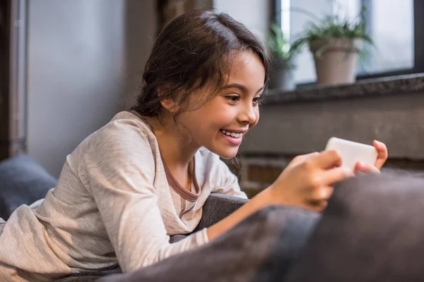 Kid with smartphone at home — Stock Photo, Image