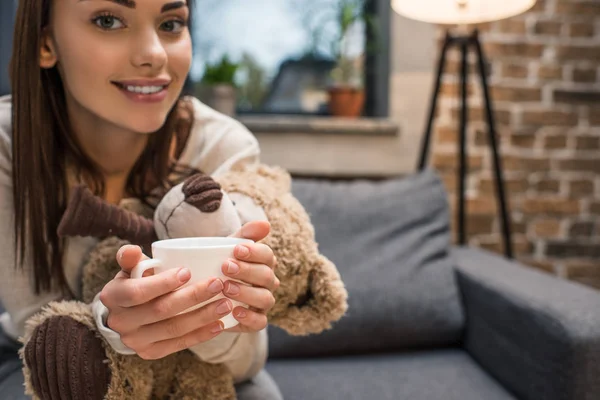 Woman with cup of drink — Free Stock Photo