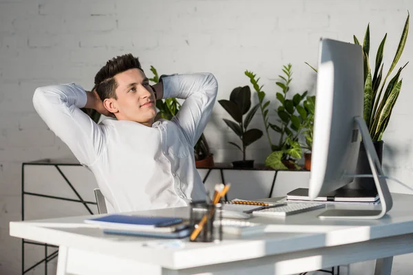 Smiling Young Businessman Hands Head Relaxing Workplace — Stock Photo, Image