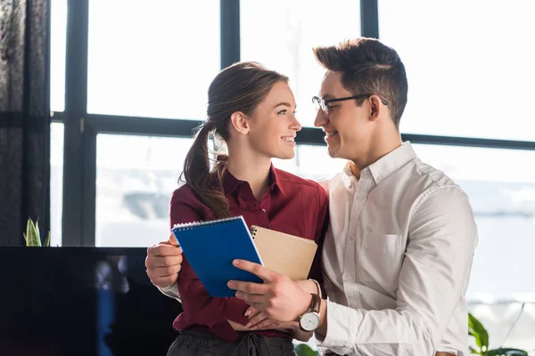 Attractive Young Managers Couple Embracing Office Workplace Romance Concept — Stock Photo, Image