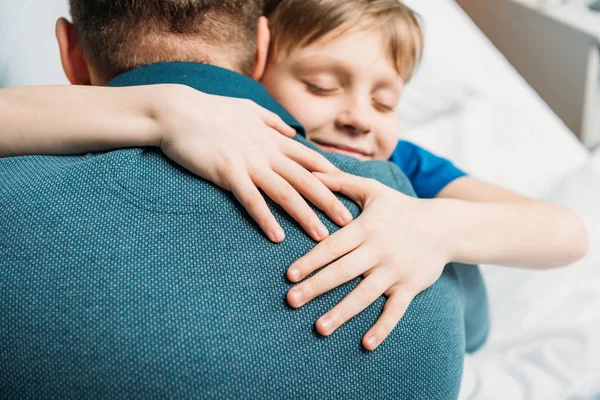 Little son hugging father — Stock Photo