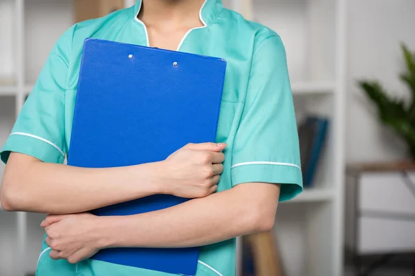 Internist holding clipboard with diagnosis — Stock Photo