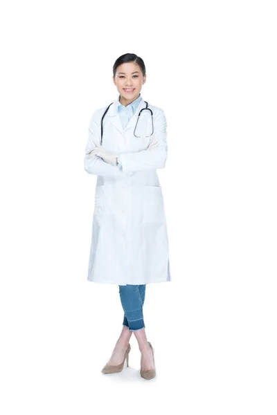 Doctor en guantes protectores con estetoscopio - foto de stock