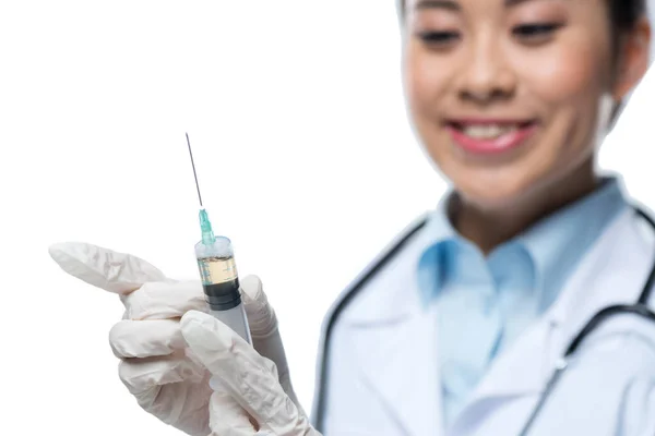 Doctor holding syringe — Stock Photo