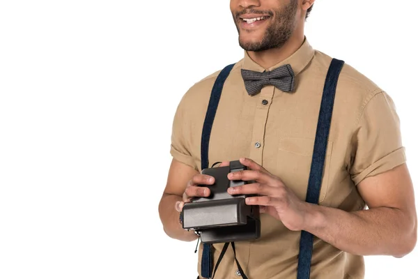Young man with instant camera — Stock Photo