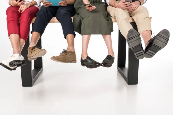 Friends using digital devices — Stock Photo