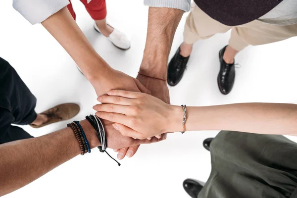 Friends putting hands together — Stock Photo