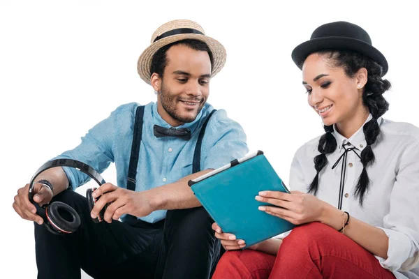 Stylish couple looking at digital tablet — Stock Photo
