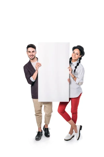 Multiethnic friends holding empty banner — Stock Photo