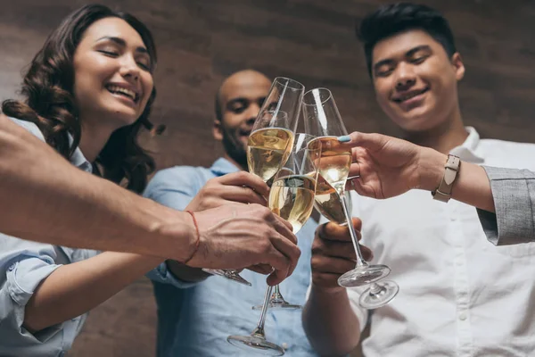 Young people celebrating with champagne — Stock Photo