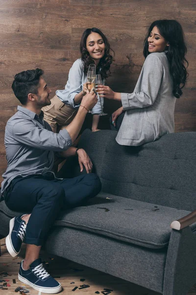 Young people celebrating with champagne — Stock Photo