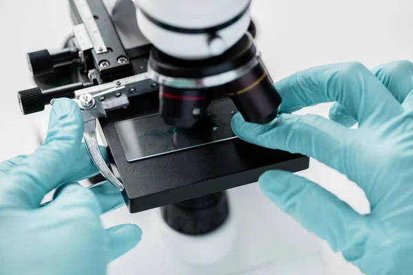 Scientist working with microscope — Stock Photo