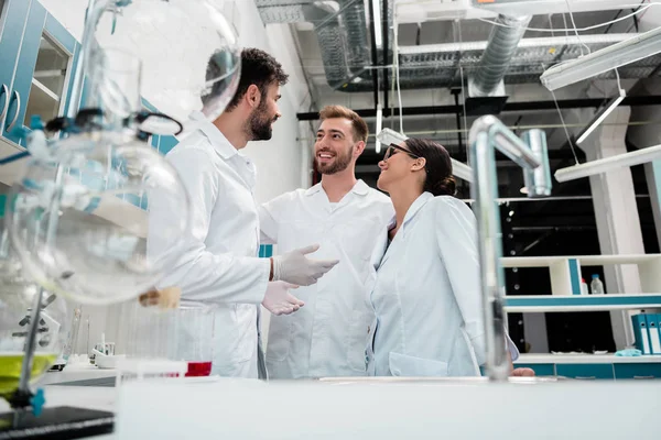 Young chemists in laboratory — Stock Photo