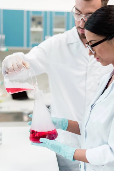 Scientists making experiment — Stock Photo