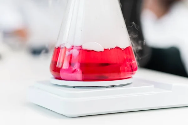 Flask with reagent and steam — Stock Photo