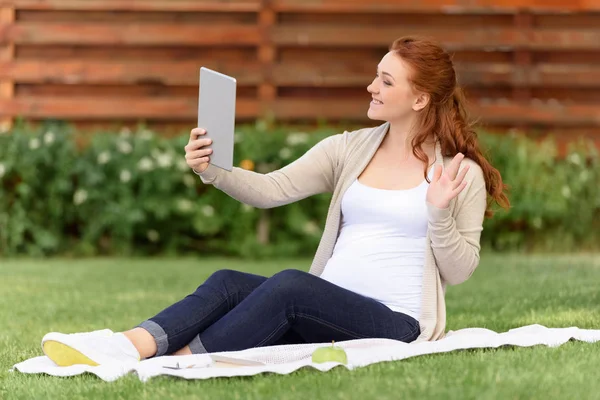 Pregnant woman making video call — Stock Photo