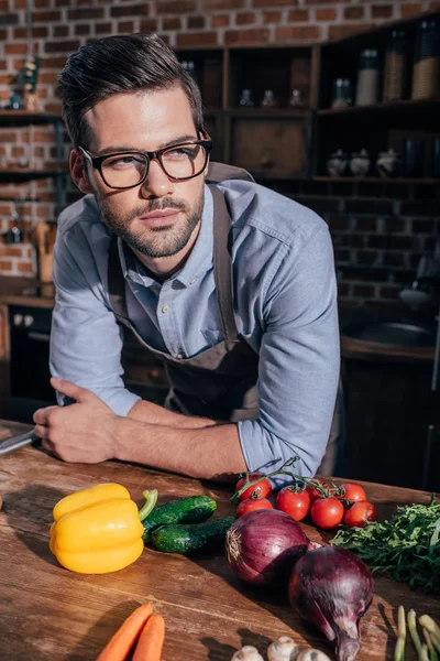 Thoughtful young man at kitchen — Stock Photo