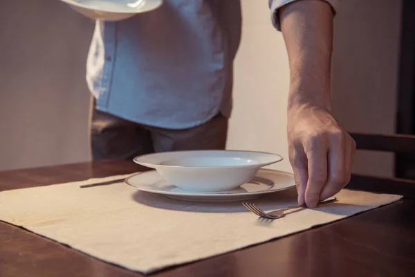 Man preparing romantic dinner — Stock Photo