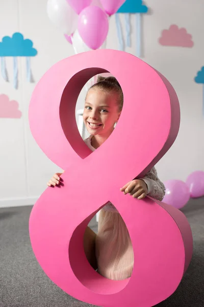 Girl with number eight at birthday party — Stock Photo