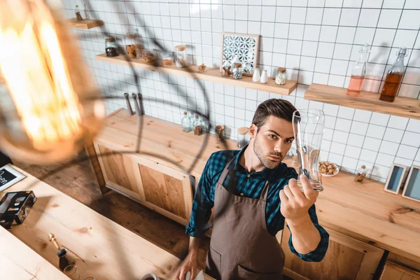 Barista checking clean glass — Stock Photo