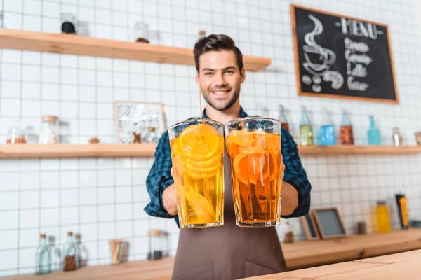 Bartender with refreshing lemonades — Stock Photo