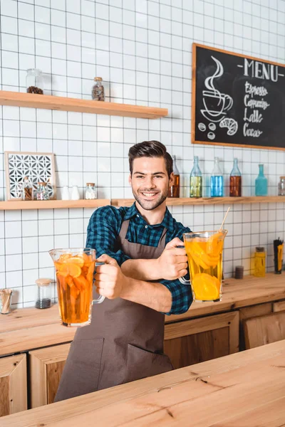 Bartender with refreshing lemonades — Stock Photo