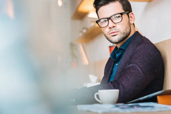 Pensive businessman in cafe — Stock Photo