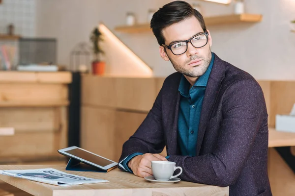 Thoughtful businessman in cafe — Stock Photo