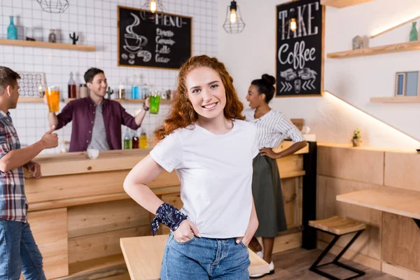 Redhead girl in cafe — Stock Photo