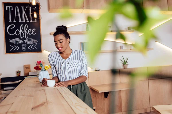 African american girl drinking coffee — Stock Photo