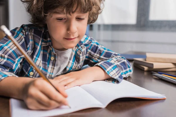 Kid doing homework — Stock Photo