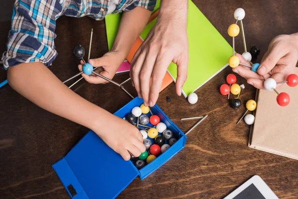 Family building atoms model — Stock Photo