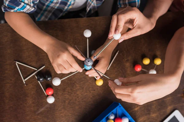 Family building atoms model — Stock Photo