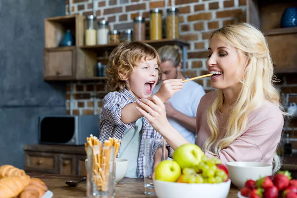 Happy mother and son during breakfast — Stock Photo