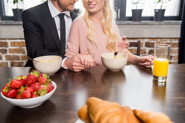 Young couple at breakfast — Stock Photo