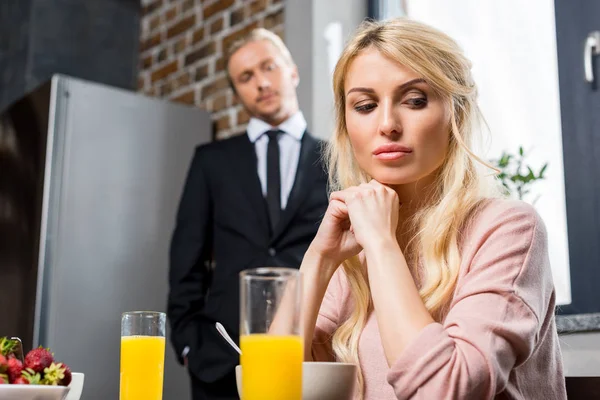 Upset woman with husband during breakfast — Stock Photo