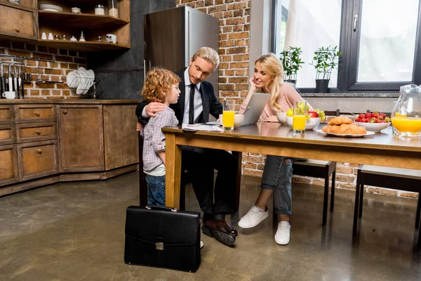 Businessman with family at morning — Stock Photo