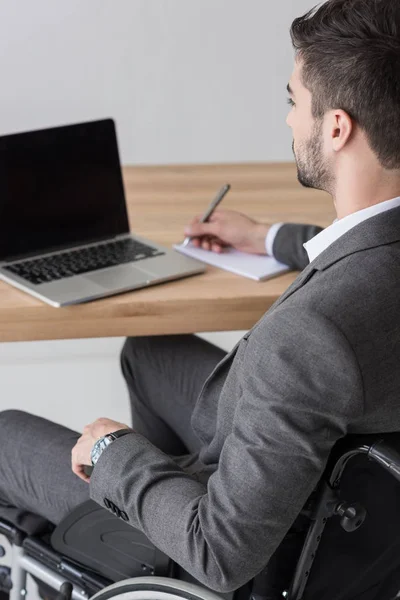 Disabled businessman working in office — Stock Photo