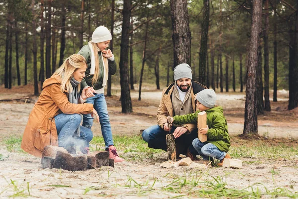 Family making campfire — Stock Photo