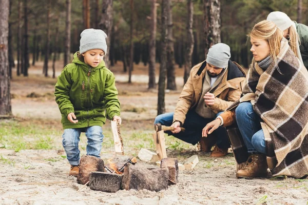 Family making campfire — Stock Photo